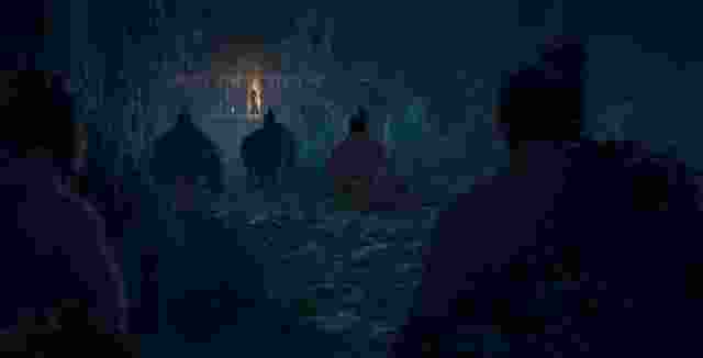 Te Waiweruweru — a boy and others carrying water in dripping cloaks at night.